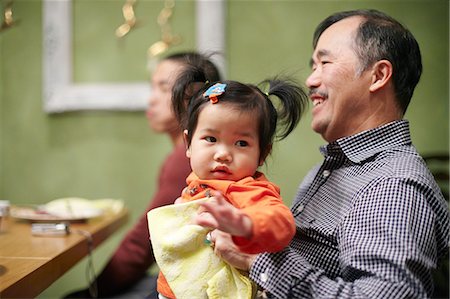 Toddler and grandfather at thanksgiving dinner Stock Photo - Premium Royalty-Free, Code: 614-08873270