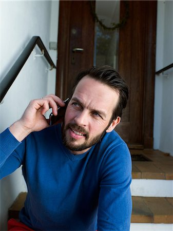 puzzled confused guy computer - Mature man using cellphone Stock Photo - Premium Royalty-Free, Code: 614-08873294