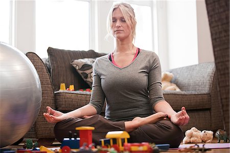 simsearch:614-01623526,k - Mid adult woman in yoga pose at home Stock Photo - Premium Royalty-Free, Code: 614-08873362