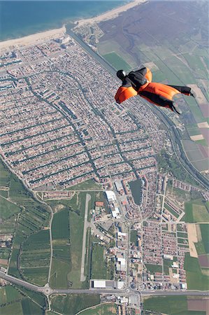 sky-diver (male) - Man wingsuit flying over Empuriabrava, Spain Stock Photo - Premium Royalty-Free, Code: 614-08873488
