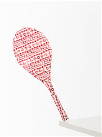Gift wrapped tennis racket against white background Stock Photo - Premium Royalty-Free, Code: 614-08873594