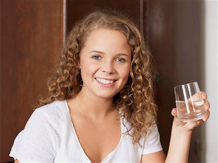 simsearch:6122-07695858,k - Portrait of young woman holding glass of water Stock Photo - Premium Royalty-Free, Code: 614-08873619