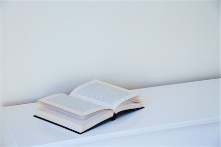 simsearch:6118-07354058,k - Open book on white table Stock Photo - Premium Royalty-Free, Code: 614-08873649