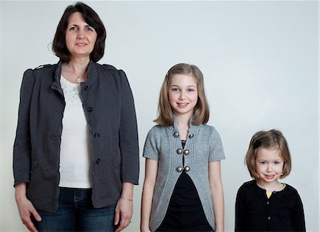 Mother and two daughters standing together, portrait Stock Photo - Premium Royalty-Free, Code: 614-08873667
