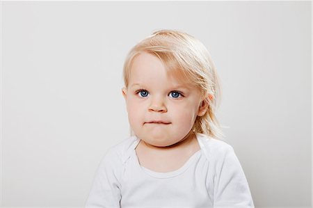 Girl biting lip Fotografie stock - Premium Royalty-Free, Codice: 614-08873882