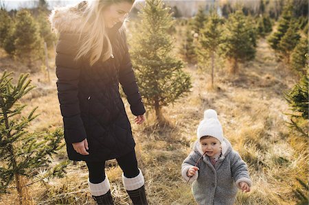 simsearch:400-08500664,k - Mother and baby girl in Christmas tree farm, Cobourg, Ontario, Canada Stock Photo - Premium Royalty-Free, Code: 614-08884440