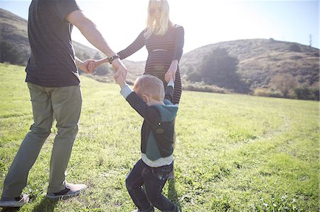 Parents and boy enjoying day outdoors Stock Photo - Premium Royalty-Free, Code: 614-08884548