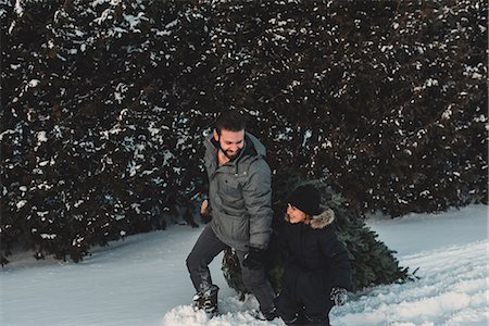 dragging christmas tree - Father and daughter out getting their own Christmas tree Stock Photo - Premium Royalty-Free, Code: 614-08884568