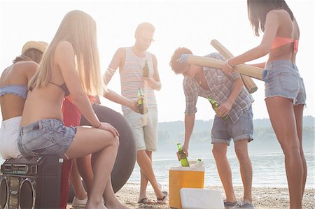 Group of friends enjoying beach party stock photo