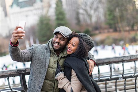 Couple taking smartphone selfie on city balcony Stock Photo - Premium Royalty-Free, Code: 614-08884730