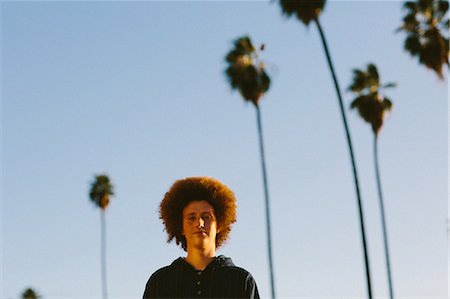 simsearch:614-08884812,k - Portrait of teenage boy with red afro hair, outdoors Photographie de stock - Premium Libres de Droits, Code: 614-08884818