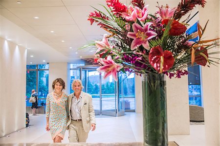 flower lobby - Senior couple walking through hotel foyer Stock Photo - Premium Royalty-Free, Code: 614-08884900