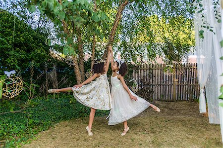 simsearch:614-02242718,k - Two young girls, dressed as fairies, dancing outdoors Stock Photo - Premium Royalty-Free, Code: 614-08884920