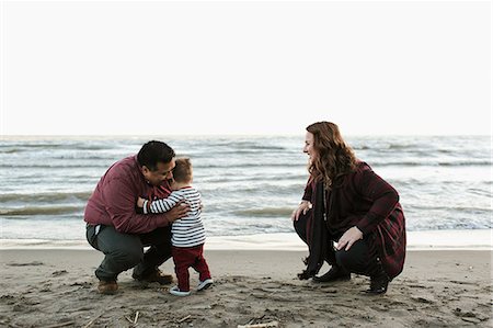 Family with baby boy on beach Stock Photo - Premium Royalty-Free, Code: 614-08880804