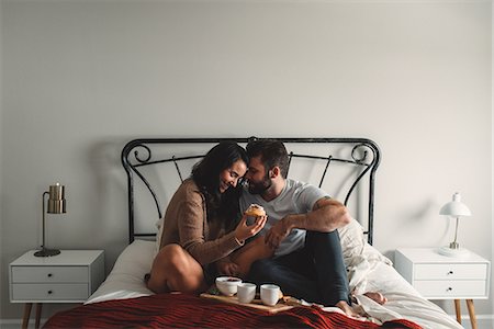 simsearch:649-08949562,k - Romantic couple eating breakfast in bed Stock Photo - Premium Royalty-Free, Code: 614-08880956