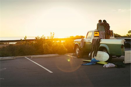 simsearch:614-07708168,k - Rear view of couple in back of pickup truck watching sunset at Newport Beach, California, USA Stock Photo - Premium Royalty-Free, Code: 614-08881444