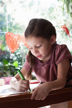 simsearch:614-07146303,k - Girl sitting at window table drawing with crayon Stock Photo - Premium Royalty-Free, Code: 614-08908313