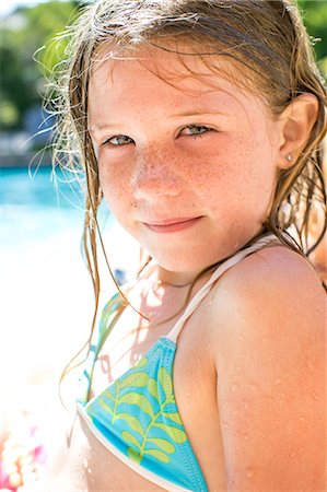 portraits girls water - Close up portrait of girl by swimming pool Stock Photo - Premium Royalty-Free, Code: 614-08908484