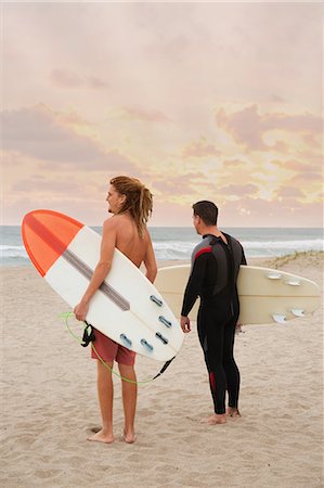 simsearch:614-03697605,k - Male lifeguard and surfer looking out to sea from beach Stock Photo - Premium Royalty-Free, Code: 614-08908653