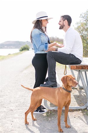 picture of two people on a park bench - Pregnant mature couple having discussion at park bench on coast Stock Photo - Premium Royalty-Free, Code: 614-08908673