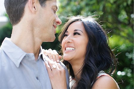 Engaged couple gazing at each other Stock Photo - Premium Royalty-Free, Code: 614-08926100