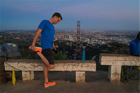 stretching top view - Jogger stretching leg, Runyon Canyon, Los Angeles, California, USA Stock Photo - Premium Royalty-Free, Code: 614-08926249