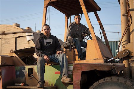 forklift operator (male) - Colleagues on construction site sitting on heavy machinery Stock Photo - Premium Royalty-Free, Code: 614-08926291