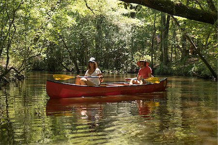 Mature couple in canoe, Econfina Creek, Youngstown, Florida, USA Stock Photo - Premium Royalty-Free, Code: 614-08926355