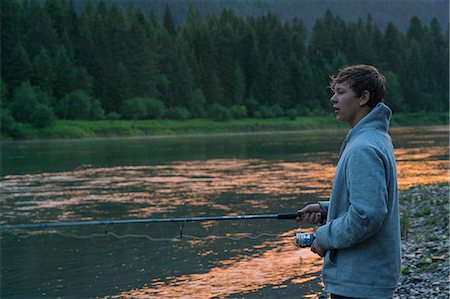 ende - Teenage boy fishing in river at sunset, Washington, USA Stockbilder - Premium RF Lizenzfrei, Bildnummer: 614-08926376