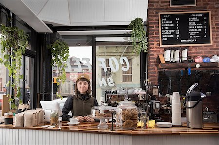 small business owner with tablet - Female employee in cafe, New York, USA Stock Photo - Premium Royalty-Free, Code: 614-08946547