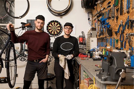 dart board photography - Technicians in bicycle workshop Stock Photo - Premium Royalty-Free, Code: 614-08946570