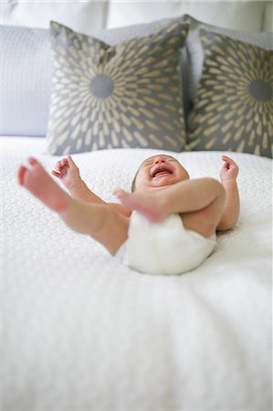 simsearch:649-07064496,k - Baby boy, lying on bed, crying, low angle view Stock Photo - Premium Royalty-Free, Code: 614-08984104