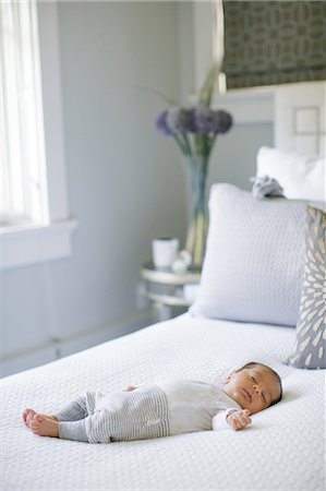 sleeping bed full body - Baby boy, lying on bed, sleeping Stock Photo - Premium Royalty-Free, Code: 614-08984110