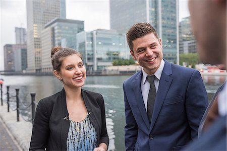 simsearch:614-09017513,k - Businessman and businesswoman in discussion outdoors, Canary Wharf, London, UK Stock Photo - Premium Royalty-Free, Code: 614-08984178