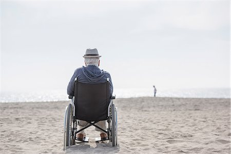 simsearch:614-07652551,k - Rear view of senior man in wheelchair looking out from beach, Santa Monica, California, USA Stock Photo - Premium Royalty-Free, Code: 614-08982918