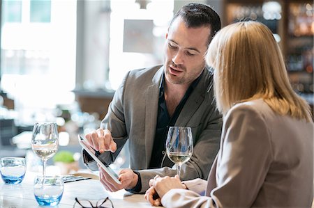 simsearch:614-08983135,k - Businessman and businesswoman at lunch in restaurant Stock Photo - Premium Royalty-Free, Code: 614-08983156