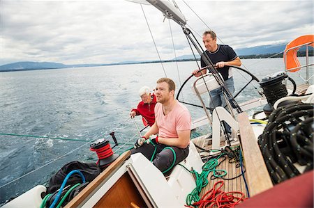 sails - Three generation family on sailing boat, Geneva, Switzerland, Europe Stock Photo - Premium Royalty-Free, Code: 614-08983236