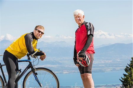 Portrait of senior man and grandson, wearing cycling clothes, standing on hill, Geneva, Switzerland, Europe Photographie de stock - Premium Libres de Droits, Code: 614-08983241