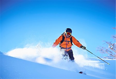 Man skiing down snow covered mountainside, Aspen, Colorado, USA Photographie de stock - Premium Libres de Droits, Code: 614-08983386