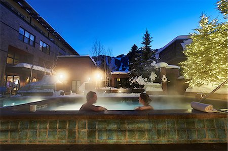 ski romantic - Mature couple relaxing in outdoor hotel hot tub at dusk, Aspen, Colorado, USA Stock Photo - Premium Royalty-Free, Code: 614-08983421