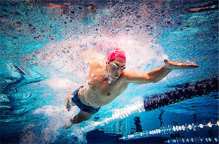 simsearch:614-08870825,k - Swimmer doing freestyle in lane Stock Photo - Premium Royalty-Free, Code: 614-08983474