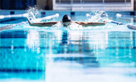 simsearch:614-08870825,k - Swimmers doing butterfly stroke in lane Stock Photo - Premium Royalty-Free, Code: 614-08983514