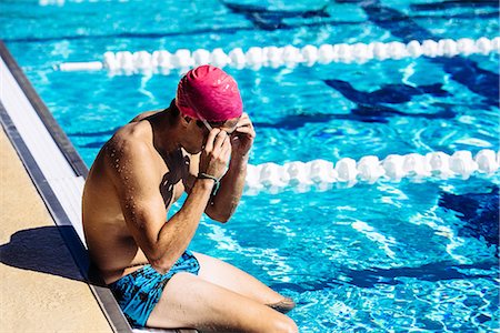 simsearch:614-08870825,k - Swimmer sitting at end of pool Stock Photo - Premium Royalty-Free, Code: 614-08983526