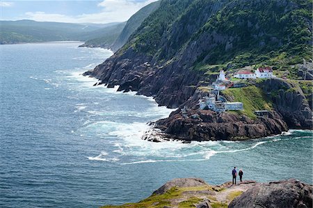 simsearch:649-08125388,k - Couple looking out from coastal cliff, St John's, Newfoundland, Canada Stock Photo - Premium Royalty-Free, Code: 614-08983569