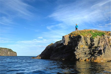 simsearch:614-08030743,k - Mid adult woman looking out from coastal cliff, St John's, Newfoundland, Canada Stock Photo - Premium Royalty-Free, Code: 614-08983571