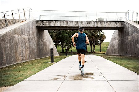 simsearch:614-08392515,k - Young man exercising outdoors, running, rear view, South Point Park, Miami Beach, Florida, USA Stock Photo - Premium Royalty-Free, Code: 614-08983867