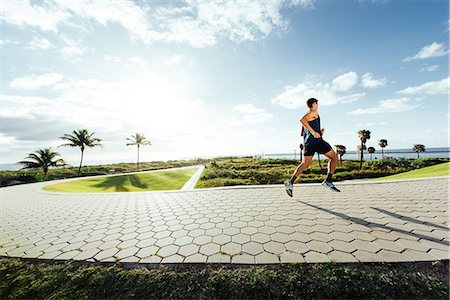 simsearch:614-08392515,k - Young man exercising, running outdoors, South Point Park, Miami Beach, Florida, USA Stock Photo - Premium Royalty-Free, Code: 614-08983884