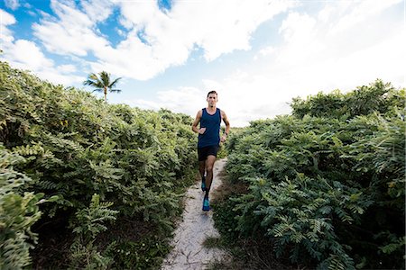 simsearch:614-08392515,k - Young man exercising, running outdoors, South Point Park, Miami Beach, Florida, USA Stock Photo - Premium Royalty-Free, Code: 614-08983882