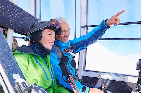 father and son skiing - Father and son in cable car, Hintertux, Tirol, Austria Stock Photo - Premium Royalty-Free, Code: 614-08990108