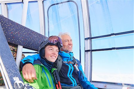 father and son skiing - Father and son in cable car, Hintertux, Tirol, Austria Stock Photo - Premium Royalty-Free, Code: 614-08990111